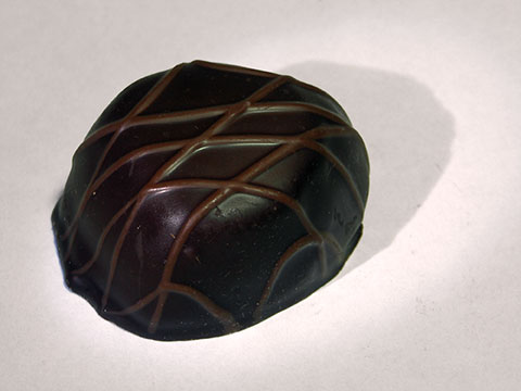 Photo of outside of See’s® Caf au Lait Truffle