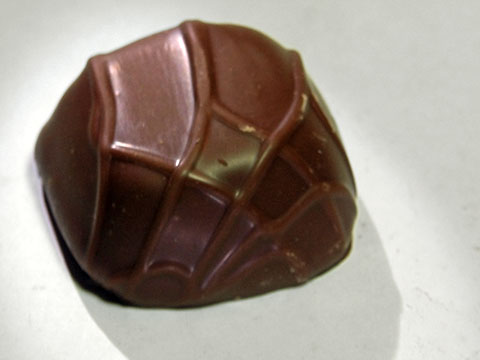 Photo of outside of See’s® Milk Chocolate Caramel (?) Truffle